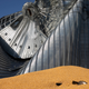Corn sits near damaged grain bins at the Heartland Co-Op grain elevator on August 11, 2020 in Luther, Iowa.